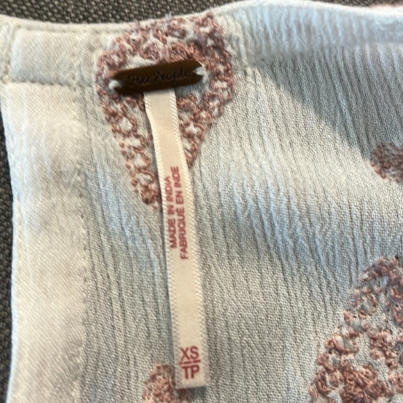 Free People size xs sleeveless flowy blouse.  Embroidery o top and hem.  Keyhole - Picture 4 of 5